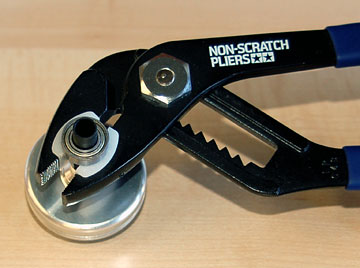 Tighten drive gear to clutch bell using a tool that won't damage the gear or bell.
