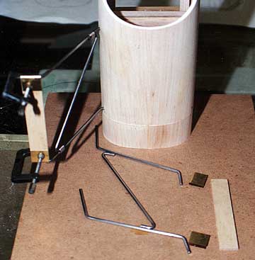 Measure the cabane assembly from the board and permanently assemble it.