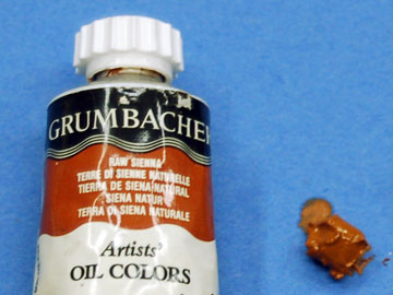 Raw Sienna oil paint is used to dry-brush highlighted and worn areas and edges.
