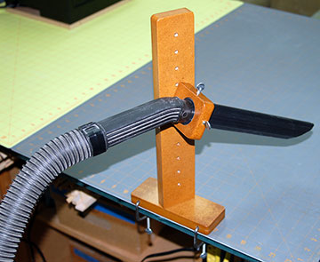 Mount the base to your bench using clamps.